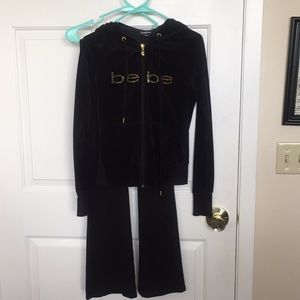 Black Bebe two-piece, zip up and pants gold letter